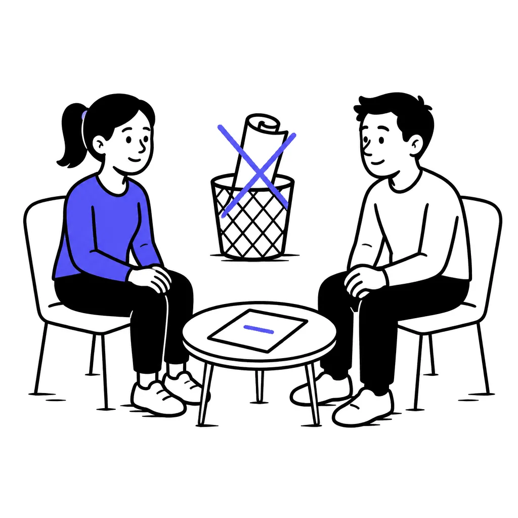 Two calm chairs with a clean one-page sheet between them; a crossed-out script scroll sits in a wastebasket behind.